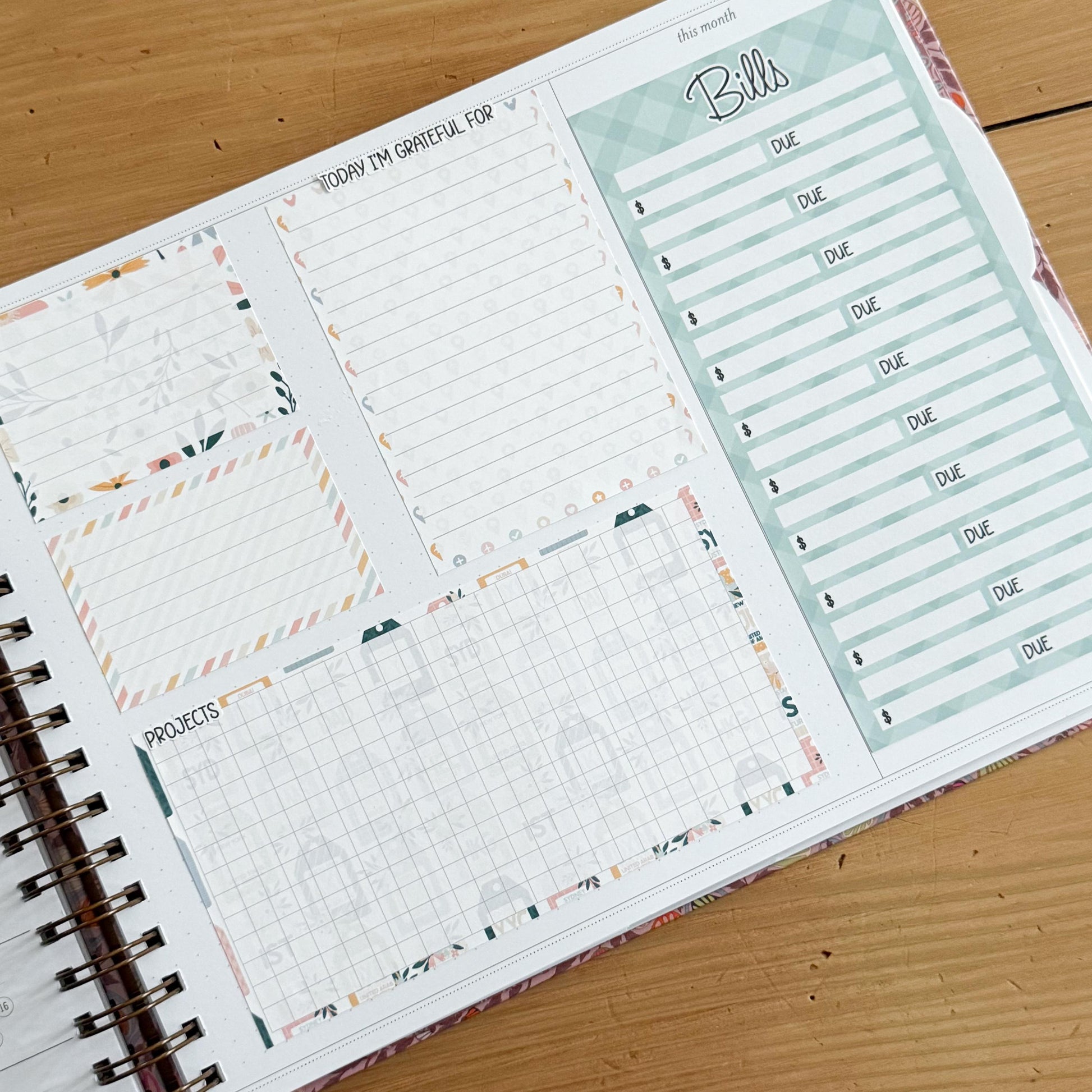The image is a spiral-bound notebook with a page dedicated to tracking bills and other financial matters. The page includes a grid for recording due dates and a list of bills to be paid.