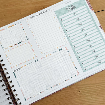 The image is a spiral-bound notebook with a page dedicated to tracking bills and other financial matters. The page includes a grid for recording due dates and a list of bills to be paid.