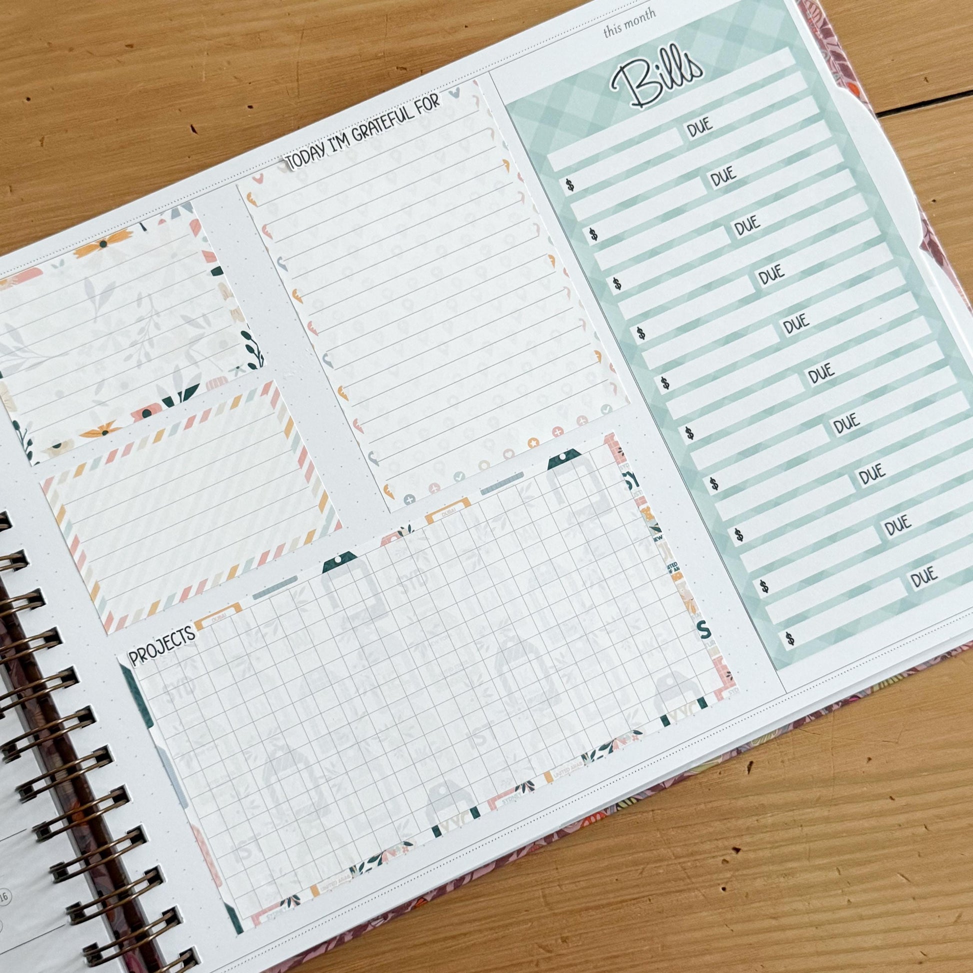 The image is a spiral-bound notebook with a page dedicated to tracking bills and other financial matters. The page includes a grid for recording due dates and a list of bills to be paid.